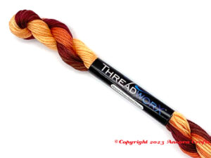 ThreadworX 1076 Honky Tonk variegated embroidery floss is a fun mix of warm yellow, burnt orange, medium brown, and dark red, perfect for fall themed, Thanksgiving, and Halloween projects