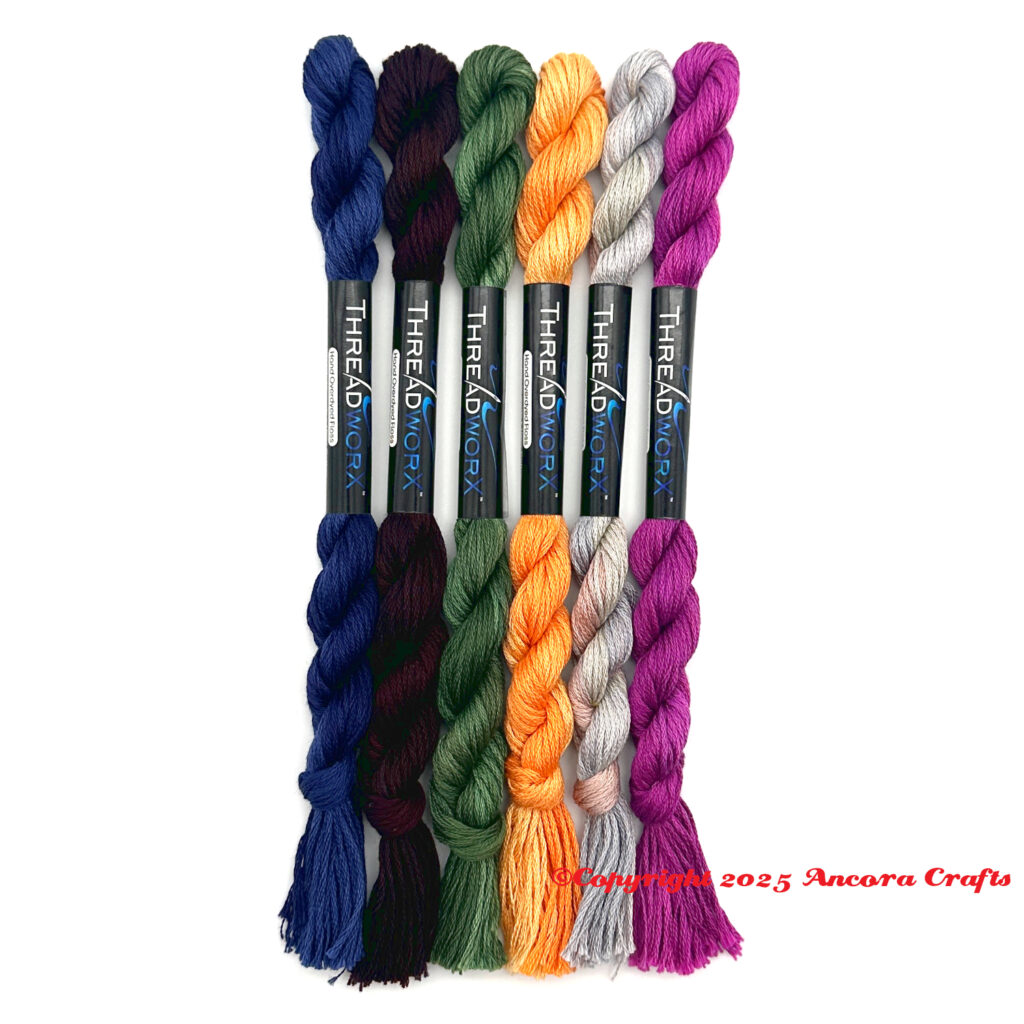 These are ThreadworX new floss colors for 2025. There's a blue, purple brown, green, yellow, gray multicolor, and a vivid purple pink.
